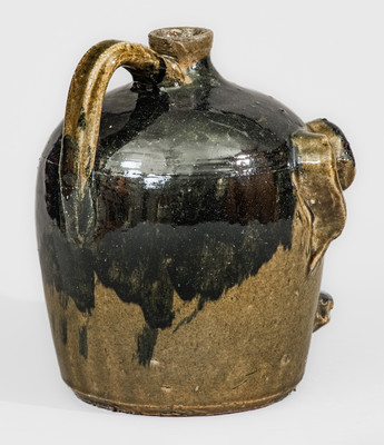 Exceedingly Rare and Important Early-Period Lanier and Arie Meaders Face Jug w/ Rock Eyes and Black Slip