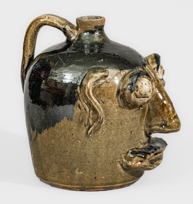 Exceedingly Rare and Important Early-Period Lanier and Arie Meaders Face Jug w/ Rock Eyes and Black Slip