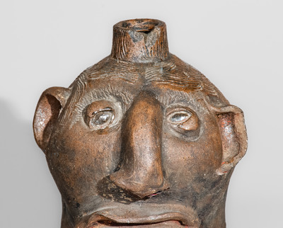 Very Rare Albany-Slip-Decorated Stoneware Face Jug, attrib. Charles P. Ferguson, Barrow County, Georgia