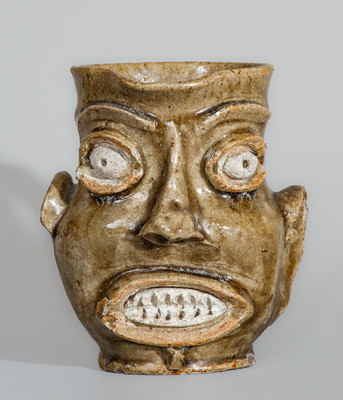 Exceedingly Rare and Important Edgefield District, SC Alkaline-Glazed Stoneware Face Pitcher