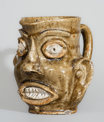 Exceedingly Rare and Important Edgefield District, SC Alkaline-Glazed Stoneware Face Pitcher