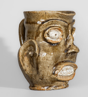 Exceedingly Rare and Important Edgefield District, SC Alkaline-Glazed Stoneware Face Pitcher