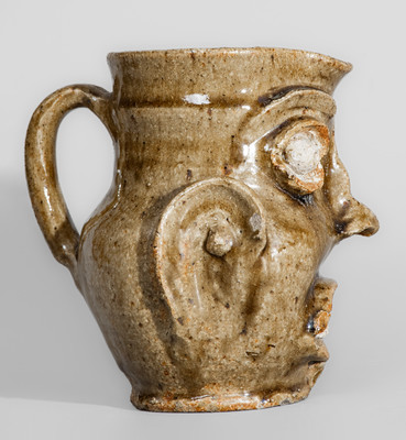 Exceedingly Rare and Important Edgefield District, SC Alkaline-Glazed Stoneware Face Pitcher