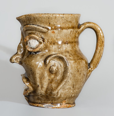 Exceedingly Rare and Important Edgefield District, SC Alkaline-Glazed Stoneware Face Pitcher