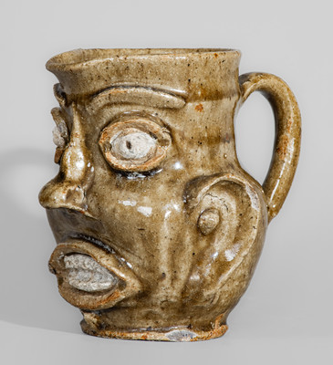 Exceedingly Rare and Important Edgefield District, SC Alkaline-Glazed Stoneware Face Pitcher