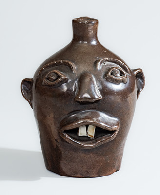 BROWN POTTERY (Arden, NC) Albany-Slip-Glazed Stoneware Face Jug, circa 1930