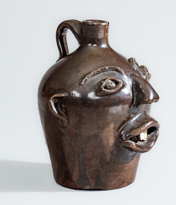 BROWN POTTERY (Arden, NC) Albany-Slip-Glazed Stoneware Face Jug, circa 1930