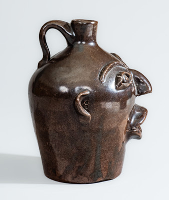 BROWN POTTERY (Arden, NC) Albany-Slip-Glazed Stoneware Face Jug, circa 1930