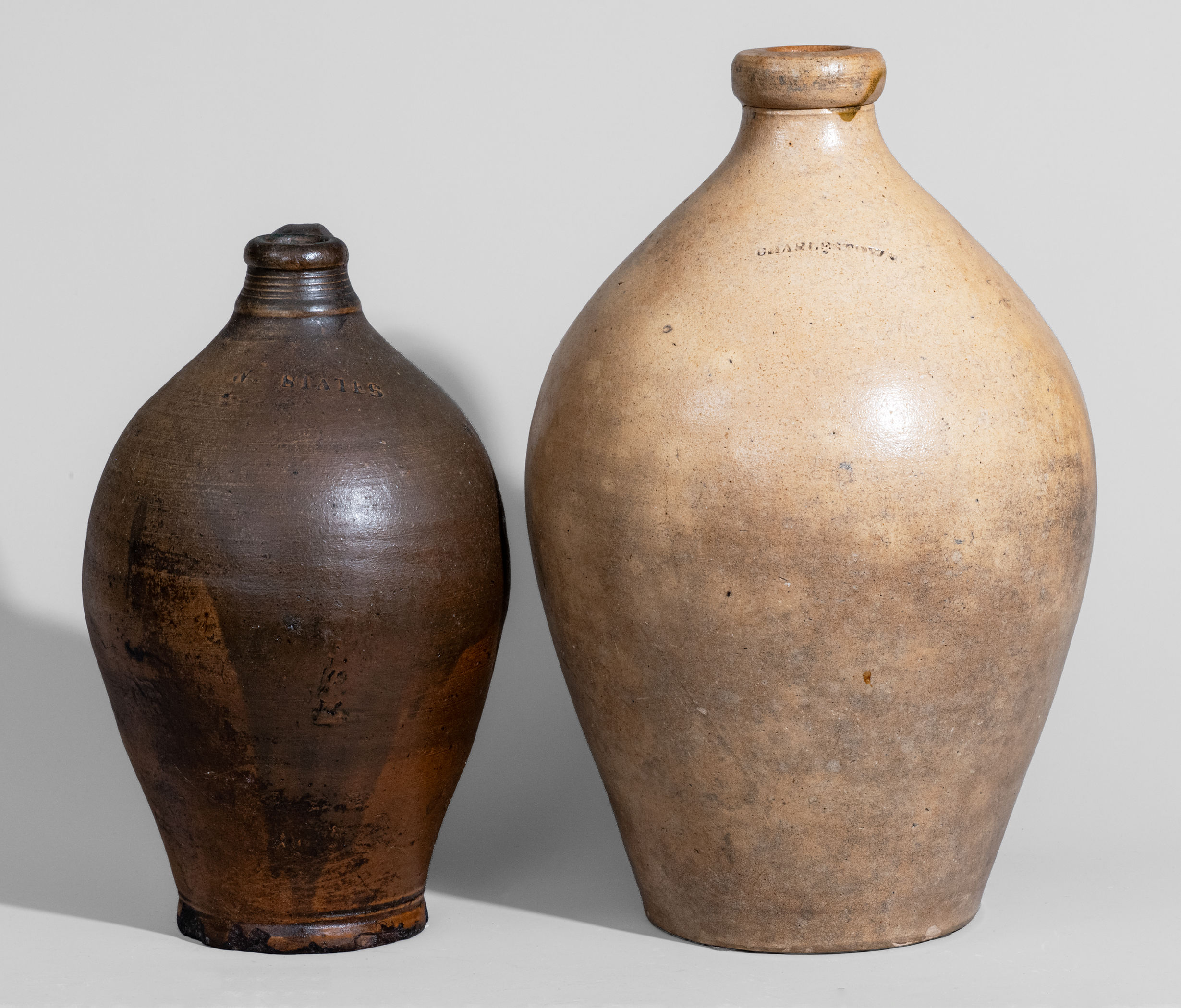 Two New England Stoneware Jugs, first half 19th century -- Lot 465