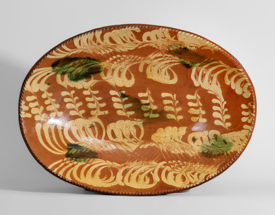 Exceedingly Rare Philadelphia Redware Loaf Dish w/ Profuse Yellow and Copper Slip Decoration, 18th century