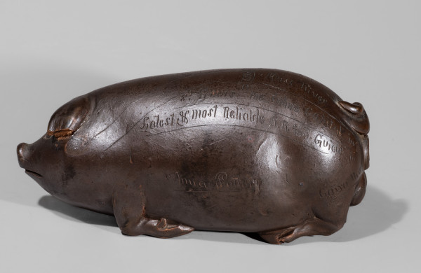 Anna Pottery Albany-Slip-Glazed Stoneware Pig Flask with Incised Railroad Map.