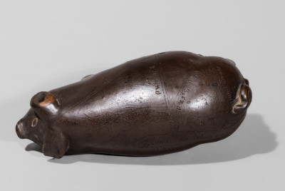 Anna Pottery Albany-Slip-Glazed Stoneware Pig Flask with Incised Railroad Map.