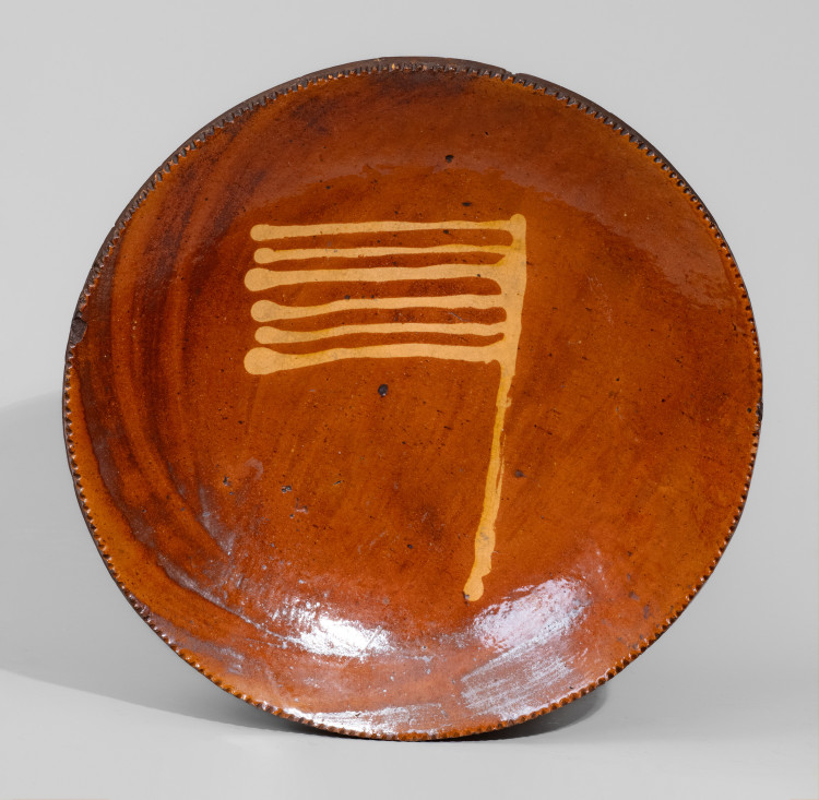 Extremely Rare Pennsylvania Redware Plate with Abstract Flag Decoration