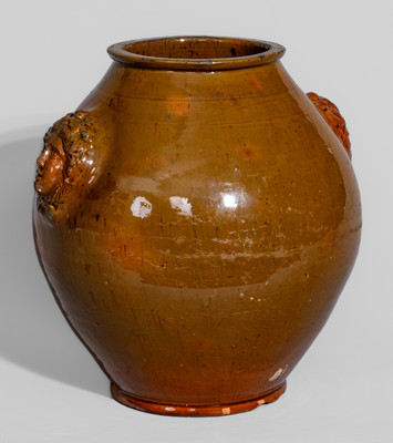 Rare and Fine Pennsylvania Redware Jar w/ Woman's Head Handles, 19th century
