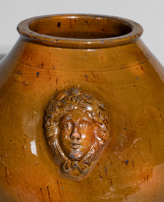 Rare and Fine Pennsylvania Redware Jar w/ Woman's Head Handles, 19th century
