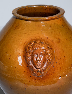 Rare and Fine Pennsylvania Redware Jar w/ Woman's Head Handles, 19th century