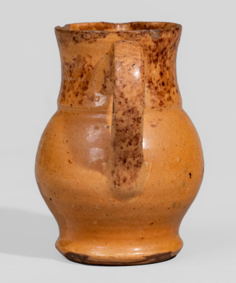 Miniature Glazed Redware Pitcher with Manganese and Copper Sponged and Freehand Decoration, Stamped 