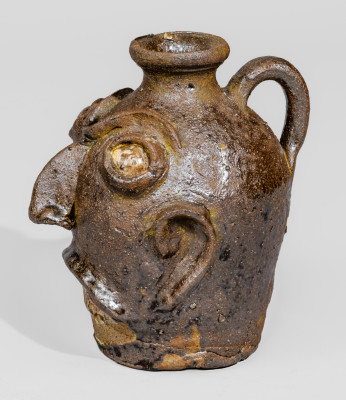 Rare Alkaline-Glazed Stoneware Face Jug with Glazed Kaolin Eyes and Teeth, Miles Mill Pottery, Edgefield District, South Carolina origin, circa 1870