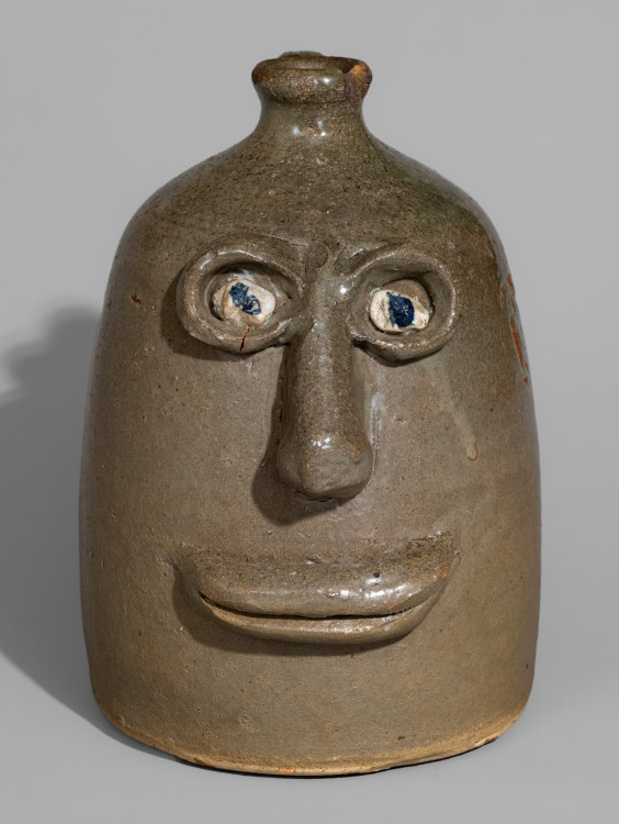 Very Rare Alkaline-Glazed Stoneware Face Jug with Rock Eyes, attributed to Lanier Meaders, Cleveland, GA, circa 1968.