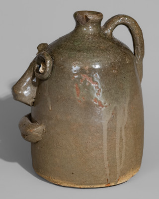 Very Rare Alkaline-Glazed Stoneware Face Jug with Rock Eyes, attributed to Lanier Meaders, Cleveland, GA, circa 1968.