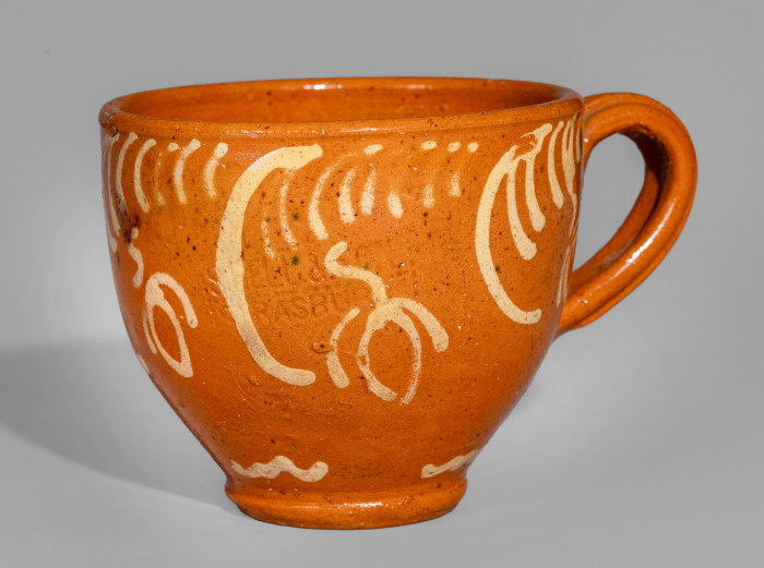 Exceptional S. BELL & SON / STRASBURG Large-Sized Redware Handled Cup with Floral Decoration
