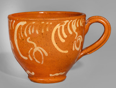 Exceptional S. BELL & SON / STRASBURG Large-Sized Redware Handled Cup with Floral Decoration