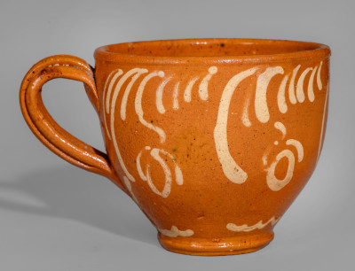 Exceptional S. BELL & SON / STRASBURG Large-Sized Redware Handled Cup with Floral Decoration