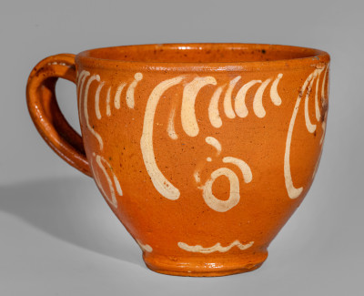 Exceptional S. BELL & SON / STRASBURG Large-Sized Redware Handled Cup with Floral Decoration