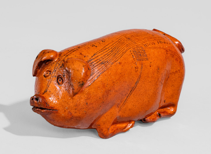 Lead-Glazed Redware Pig Bottle with Incised Map, attributed to Anna Pottery, third quarter 19th century.
