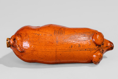 Lead-Glazed Redware Pig Bottle with Incised Map, attributed to Anna Pottery, third quarter 19th century.