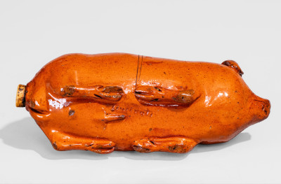 Lead-Glazed Redware Pig Bottle with Incised Map, attributed to Anna Pottery, third quarter 19th century.