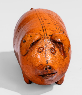 Lead-Glazed Redware Pig Bottle with Incised Map, attributed to Anna Pottery, third quarter 19th century.