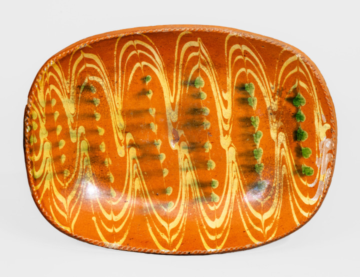 Fine Redware Loaf Dish with Elaborate Two-Color Slip Decoration.