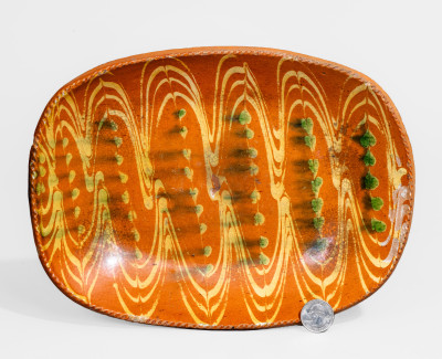 Fine Redware Loaf Dish with Elaborate Two-Color Slip Decoration.