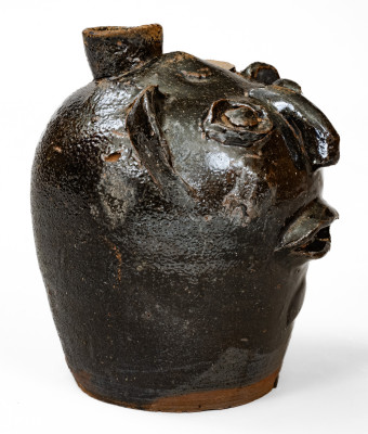 Rare Alkaline-Glazed Stoneware Face Harvest Jug, probably Upstate SC, late 19th / early 20th century