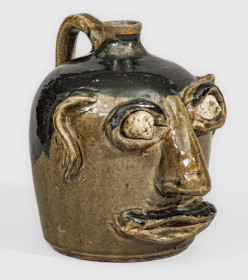Exceedingly Rare and Important Early-Period Lanier and Arie Meaders Face Jug w/ Rock Eyes and Black Slip