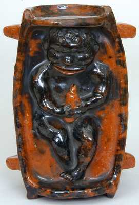 Probably PA Redware Bank w/ the Figure of an African-American Infant
