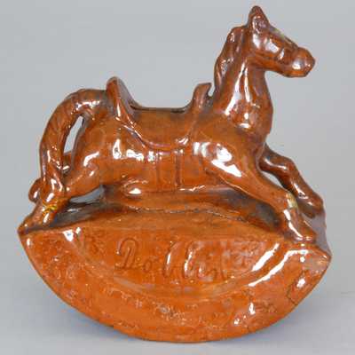 Probably Pennsylvania Redware Rocking Horse Bank