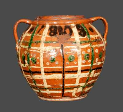Outstanding Ovoid Redware Jar Dated 1808 and Decorated with Green, Brown and Yellow Slip