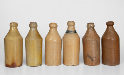 Lot of Six: Stoneware Bottles with Impressed Names