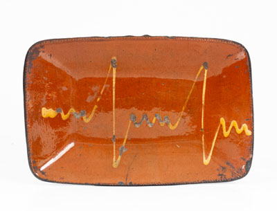 Unusual Slip-Decorated Redware Loaf Dish, probably Huntington, Long Island or Norwalk, CT, c1840